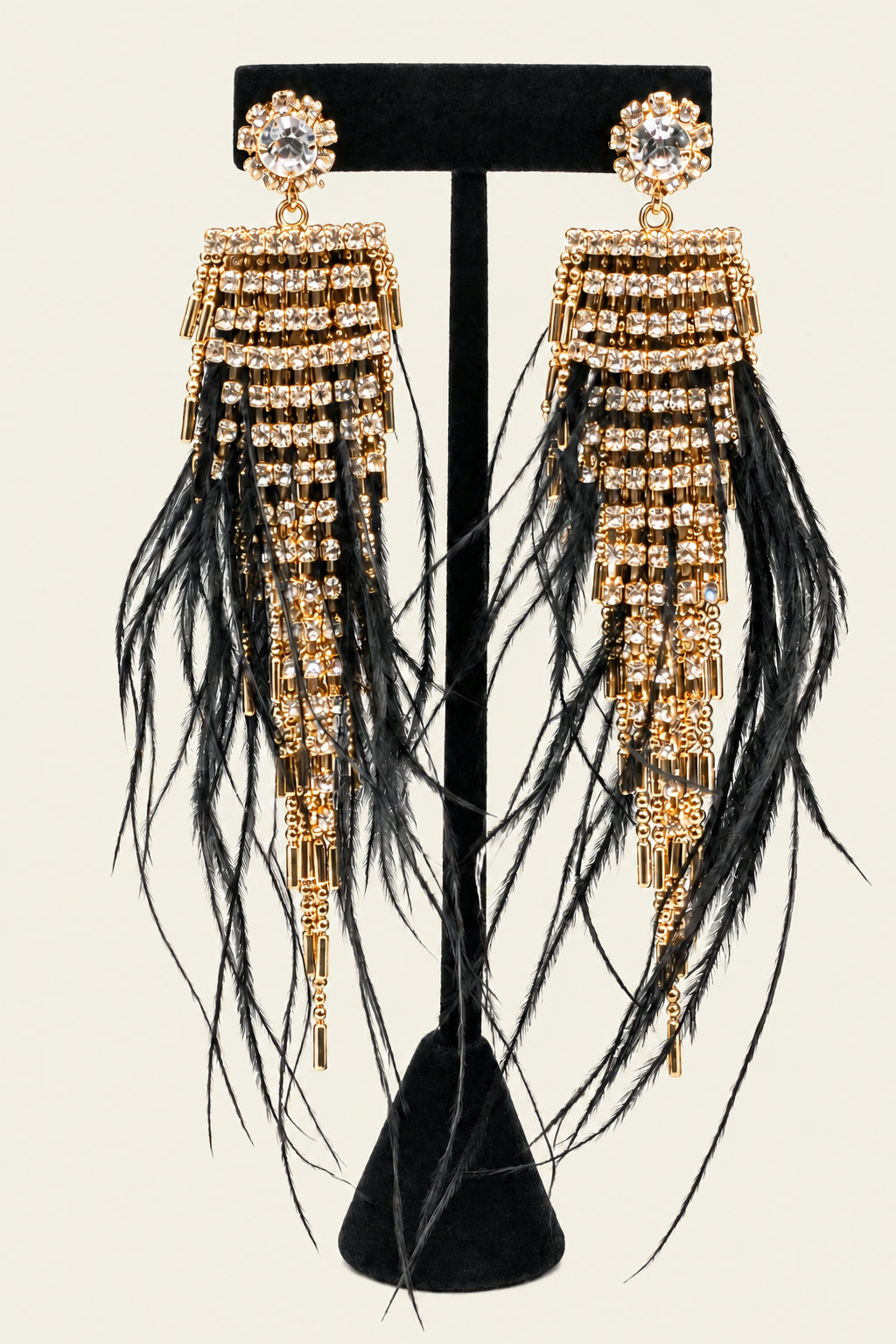 Gold tone rhinestone earrings with black feathers